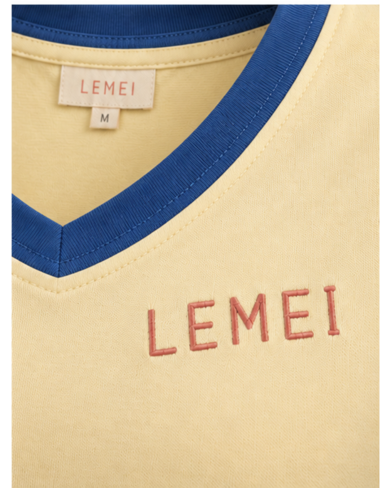 Lemei Amalfi women's lemon V-neck T-shirt with cobalt trim, close-up of the neckline, neck label and embroidered logo